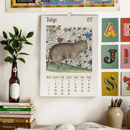 Średniowieczne koty w bogatej oprawie detali